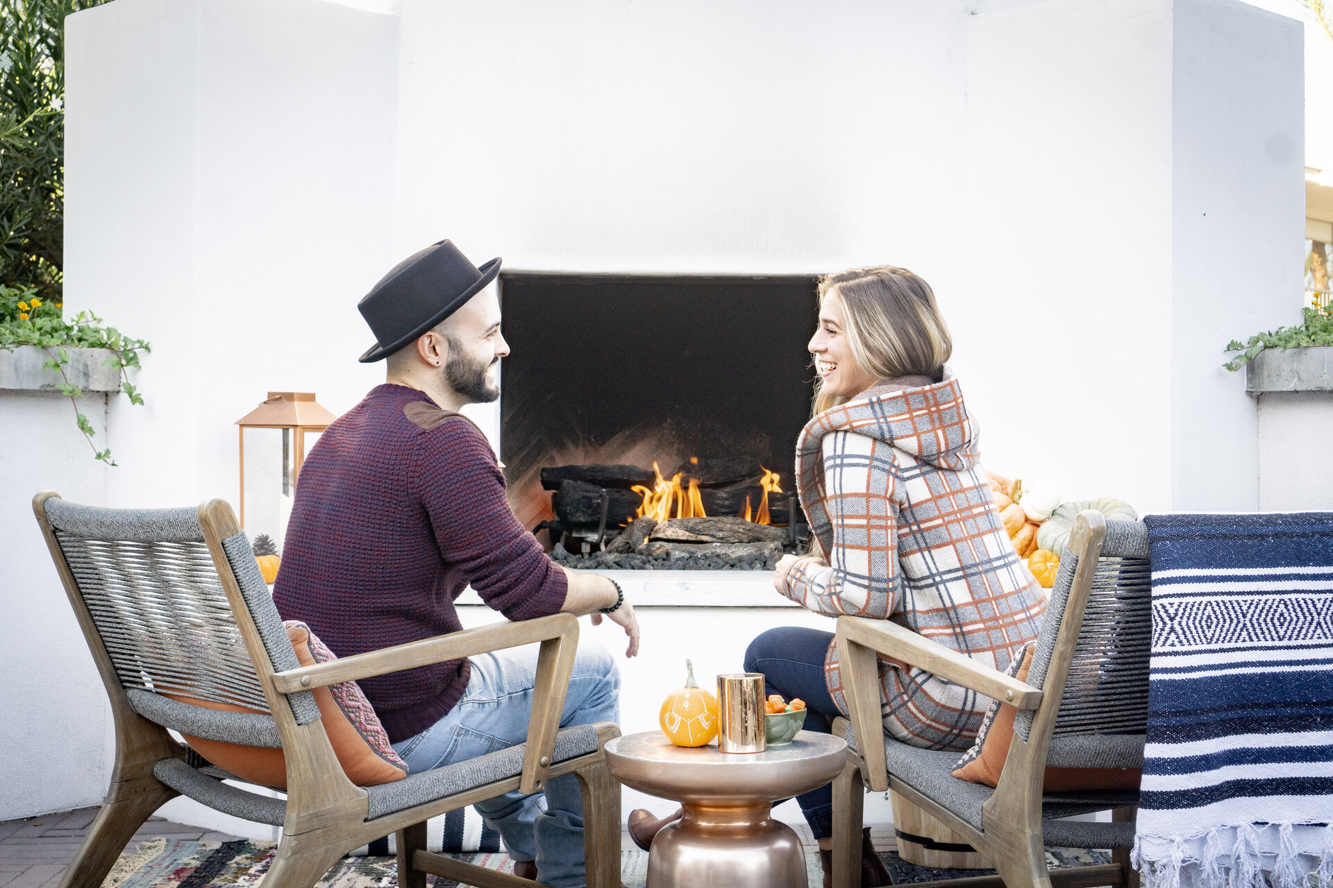 couple sitting in front of a fireplace